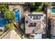 Aerial shot of a home featuring solar panels, a private pool, lush landscaping, and a patio area at 1473 E Mead Dr, Chandler, AZ 85249