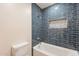 Bathroom features a tiled shower/bath combo and a built-in shelf niche at 1473 E Mead Dr, Chandler, AZ 85249