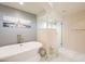 This bright bathroom showcases a standalone tub and separate glass shower for a luxurious experience at 1473 E Mead Dr, Chandler, AZ 85249