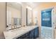 Bathroom boasts dual sinks, marble countertop, and a tiled shower/bath combo at 1473 E Mead Dr, Chandler, AZ 85249