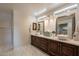 Spa-like bathroom featuring double sinks with granite counters and stylish mirrors at 1473 E Mead Dr, Chandler, AZ 85249