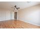 This bedroom boasts hardwood floors, a modern ceiling fan and bright closet doors at 1473 E Mead Dr, Chandler, AZ 85249