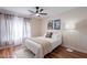 Bright bedroom with wood floors features a ceiling fan and natural light at 1473 E Mead Dr, Chandler, AZ 85249