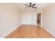 This is a spacious bedroom with hardwood floors, closet doors and a modern ceiling fan at 1473 E Mead Dr, Chandler, AZ 85249