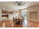 Bright dining area featuring hardwood floors, a view to the kitchen, and access to the yard through a glass sliding door at 1473 E Mead Dr, Chandler, AZ 85249