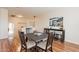 This dining area features hardwood floors, comfortable seating, and an adjacent entertaining area at 1473 E Mead Dr, Chandler, AZ 85249