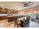 Large kitchen with dark wood cabinets, white marble countertops, and island with seating at 1473 E Mead Dr, Chandler, AZ 85249