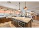 Spacious kitchen featuring a large island with marble countertop and farmhouse sink at 1473 E Mead Dr, Chandler, AZ 85249