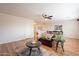 This home's living room features hardwood floors, a comfortable sofa, and an adjacent dining and entertaining area at 1473 E Mead Dr, Chandler, AZ 85249