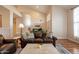 Cozy living room with a high ceiling, plush seating, and natural light at 1473 E Mead Dr, Chandler, AZ 85249