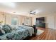 Comfortable main bedroom with natural light and a dark wood dresser and TV at 1473 E Mead Dr, Chandler, AZ 85249