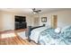 Serene main bedroom featuring a bed frame, dresser with TV, and natural light at 1473 E Mead Dr, Chandler, AZ 85249