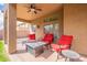 Relaxing covered patio seating area with a fire pit, perfect for entertaining at 1473 E Mead Dr, Chandler, AZ 85249