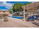 Sparkling pool with a pergola-covered seating area is perfect for outdoor relaxation and entertaining at 1473 E Mead Dr, Chandler, AZ 85249