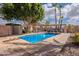 Gorgeous pool with ample seating and a lush, tropical setting offers a private retreat at 1473 E Mead Dr, Chandler, AZ 85249