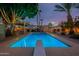 Inviting swimming pool and patio area with tall palm trees and shade structures at 1473 E Mead Dr, Chandler, AZ 85249