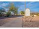 Curving walking path lined with desert foliage and informative signage in a well-maintained community park at 1473 E Mead Dr, Chandler, AZ 85249