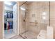 Tiled shower with glass door and a built-in seat next to a walk in closet at 16203 E Ridgeline Dr, Fountain Hills, AZ 85268