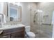 Modern bathroom featuring a marble vanity, a walk-in shower, and a modern toilet at 16203 E Ridgeline Dr, Fountain Hills, AZ 85268