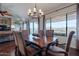 Dining room with a chandelier, table set and six chairs with an excellent view at 16203 E Ridgeline Dr, Fountain Hills, AZ 85268