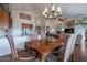 Elegant dining room featuring a chandelier and seating for six at 16203 E Ridgeline Dr, Fountain Hills, AZ 85268