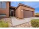 Home exterior with a desert landscape, concrete walkway, and a two-car garage at 16203 E Ridgeline Dr, Fountain Hills, AZ 85268