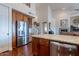 Modern kitchen with stainless steel appliances, granite counters, and wood cabinetry at 16203 E Ridgeline Dr, Fountain Hills, AZ 85268