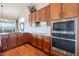 Stylish kitchen with stainless steel appliances, wooden cabinets, and a tiled backsplash at 16203 E Ridgeline Dr, Fountain Hills, AZ 85268