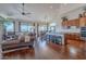 Open-concept living room with hardwood floors, a vaulted ceiling, and large windows at 16203 E Ridgeline Dr, Fountain Hills, AZ 85268