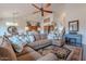 Spacious living room with vaulted ceilings, a large brown couch, and an area rug at 16203 E Ridgeline Dr, Fountain Hills, AZ 85268