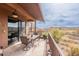 Inviting outdoor patio with a table, chairs, and scenic hillside views at 16203 E Ridgeline Dr, Fountain Hills, AZ 85268