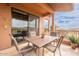 Inviting patio area with a tile floor, dining table and outdoor views at 16203 E Ridgeline Dr, Fountain Hills, AZ 85268