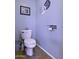 Cozy bathroom featuring blue walls, neutral tile floors and elegant coastal-themed decorations at 16606 S 15Th Ln, Phoenix, AZ 85045