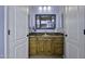 Well-lit bathroom vanity with a granite countertop and plenty of storage space at 16606 S 15Th Ln, Phoenix, AZ 85045