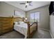 Cozy bedroom with natural wooden furniture and a sunlit window at 16606 S 15Th Ln, Phoenix, AZ 85045