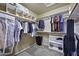 Walk-in closet with custom shelving and ample hanging space at 16606 S 15Th Ln, Phoenix, AZ 85045