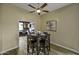 Dining area with a view of a home office, wood floors and modern ceiling fan at 16606 S 15Th Ln, Phoenix, AZ 85045