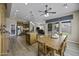 Open floor plan with a dining table and chairs leading into the kitchen and living area at 16606 S 15Th Ln, Phoenix, AZ 85045