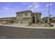 Charming two-story home with desert landscaping, spacious garage, and a neutral color palette at 16606 S 15Th Ln, Phoenix, AZ 85045