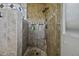 Tiled shower featuring a built-in seat and storage niches at 16606 S 15Th Ln, Phoenix, AZ 85045