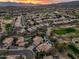 Stunning aerial view of a community showcasing beautiful homes, lush golf course, and serene desert landscape at 16646 S 16Th St, Phoenix, AZ 85048