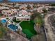 An aerial view of a desert home with a pool, putting green, and beautifully landscaped backyard oasis at 16646 S 16Th St, Phoenix, AZ 85048