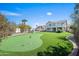 Expansive backyard with artificial turf, putting green, and a covered patio perfect for entertaining at 16646 S 16Th St, Phoenix, AZ 85048