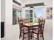 Cozy breakfast nook with a bright window and four chairs at 16646 S 16Th St, Phoenix, AZ 85048