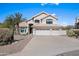 Beautiful two-story home featuring a three-car garage, desert landscaping, and a red tile roof at 16646 S 16Th St, Phoenix, AZ 85048