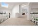 Bright foyer with a skylight that leads to the living area and carpeted stairs at 16646 S 16Th St, Phoenix, AZ 85048