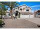 Charming home with a three-car garage, mature landscaping, and inviting curb appeal at 16646 S 16Th St, Phoenix, AZ 85048