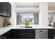 Kitchen sink with quartz countertops and a view of the backyard at 16646 S 16Th St, Phoenix, AZ 85048