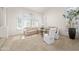 Bright living room with shuttered windows, neutral carpeting, and vaulted ceilings at 16646 S 16Th St, Phoenix, AZ 85048