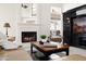 Close-up of living room showcasing the fireplace, media center, and seating area at 16646 S 16Th St, Phoenix, AZ 85048